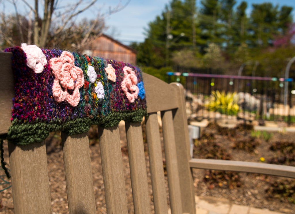 bench with knitted and crochet decorations