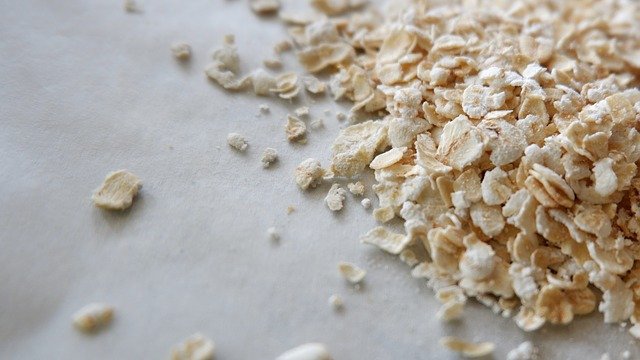 pile of raw oats on a white tabletop