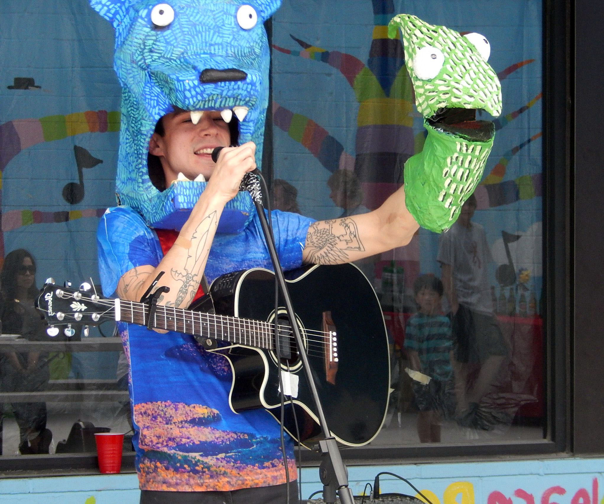kevin sherry with puppets and guitar