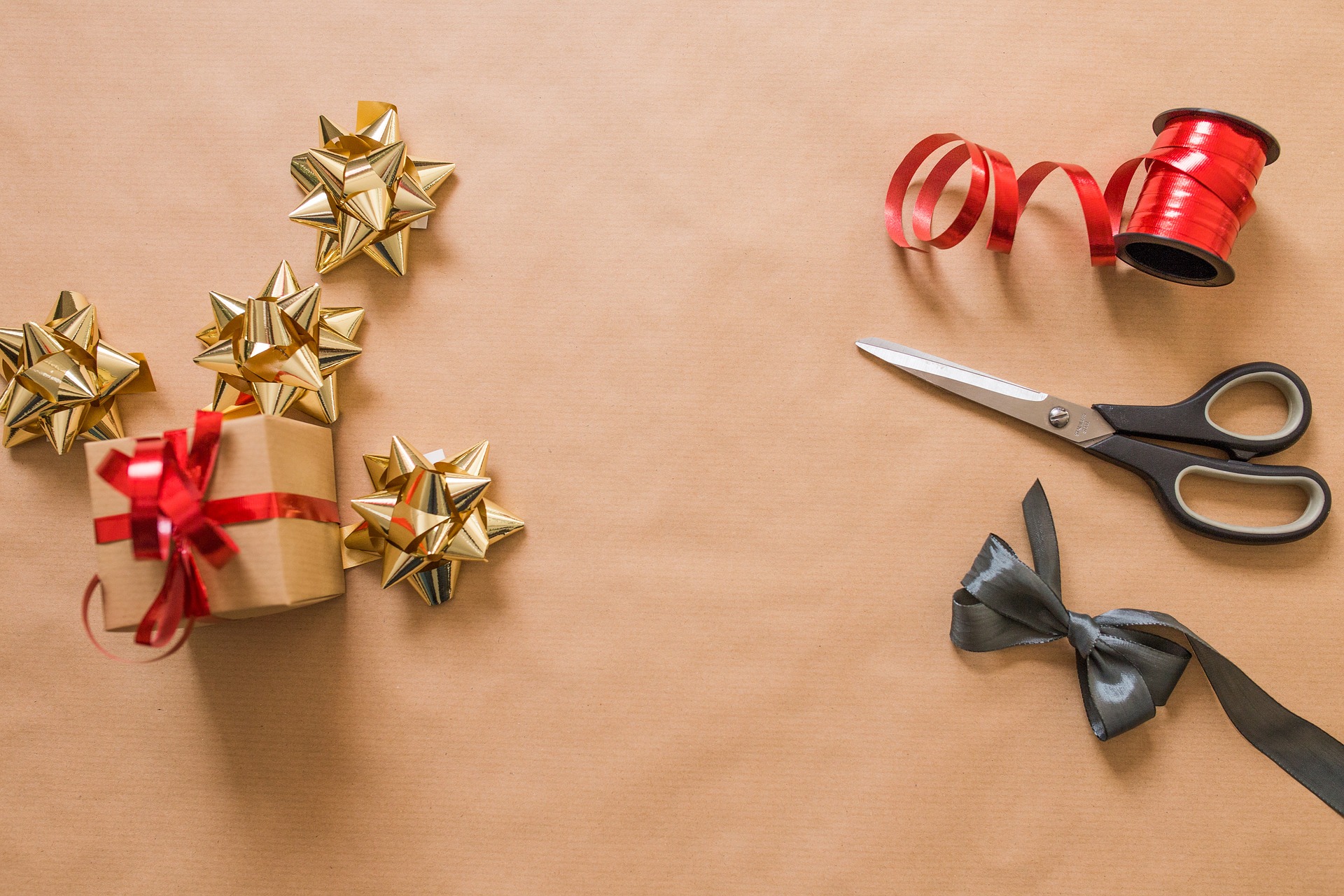 Image shows ribbons and bows for gifts. 