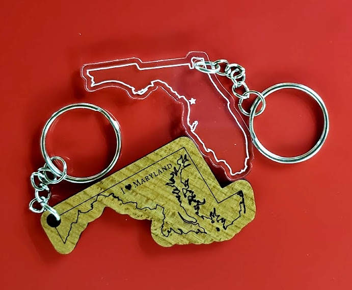 Wooden engraved keychain with Maryland outline. Text says "I Love Maryland" Florida acryclic cut and engraved keychain with star