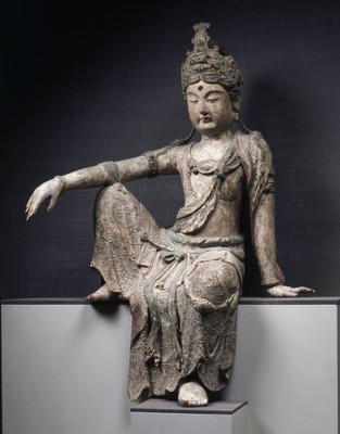 a gray stone statue from the ancient chine sitting with black background