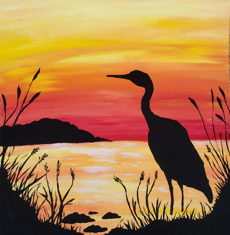 simple painting of the silhouette heron wading in the reeds against a sunset sky