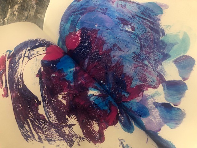 Blue and purple paint marks on pages