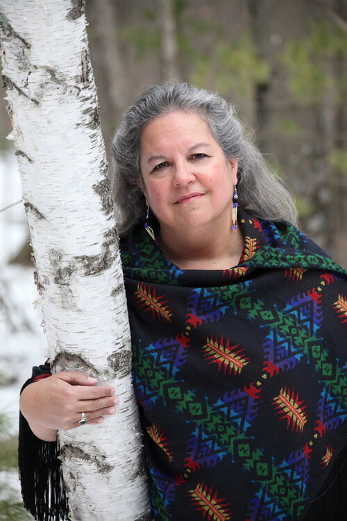 author robin wall kimmerer next to a birch tree