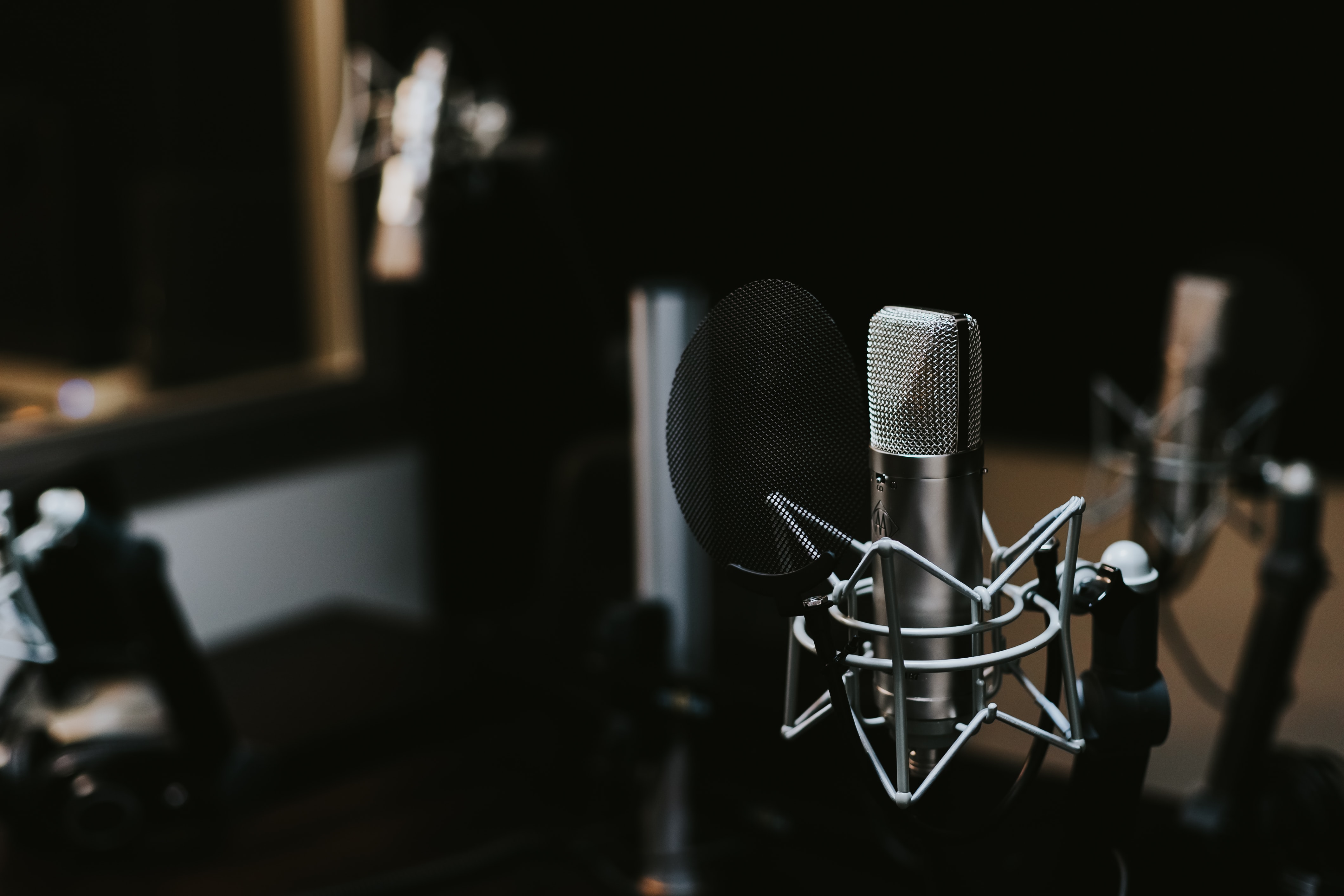 dark image of podcasting equipment and microphone