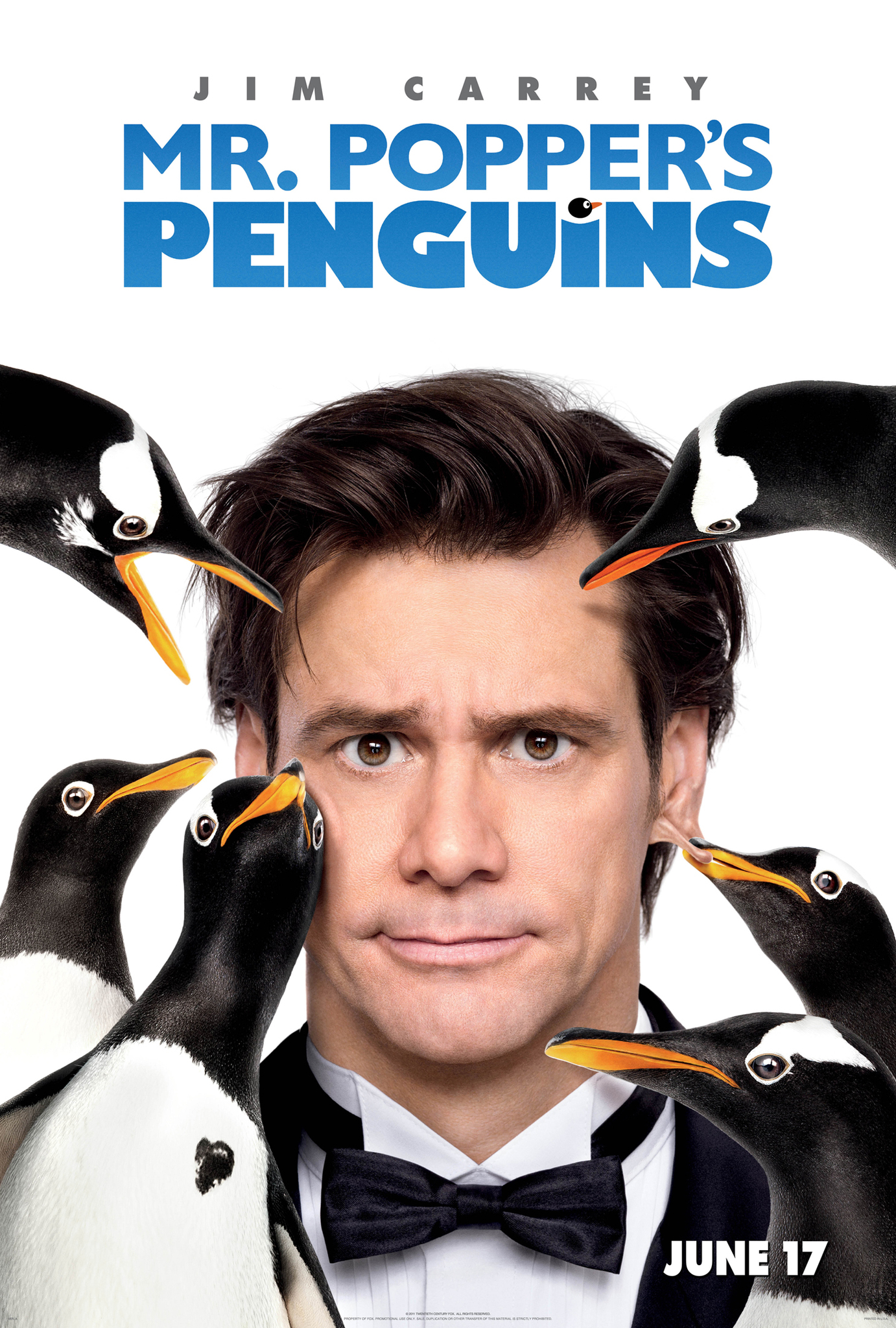 man with penguins pecking at his head