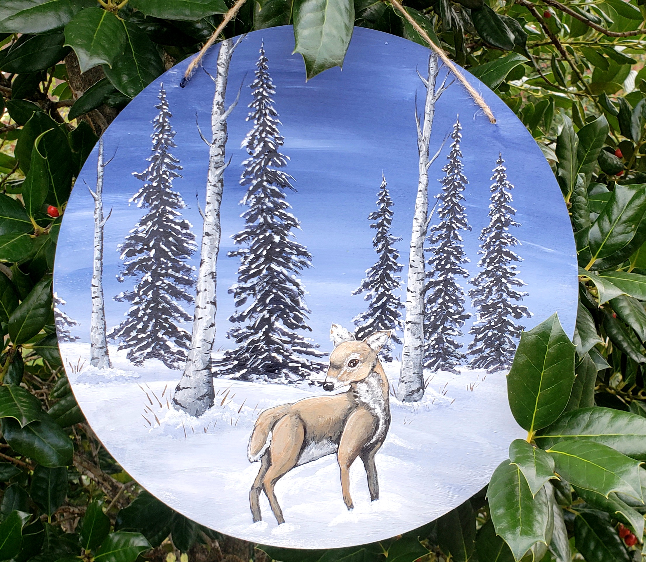 a painted snow scene with a deer