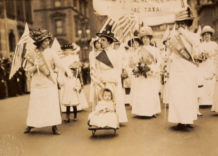 Women campaigning for women's suffrage by marching