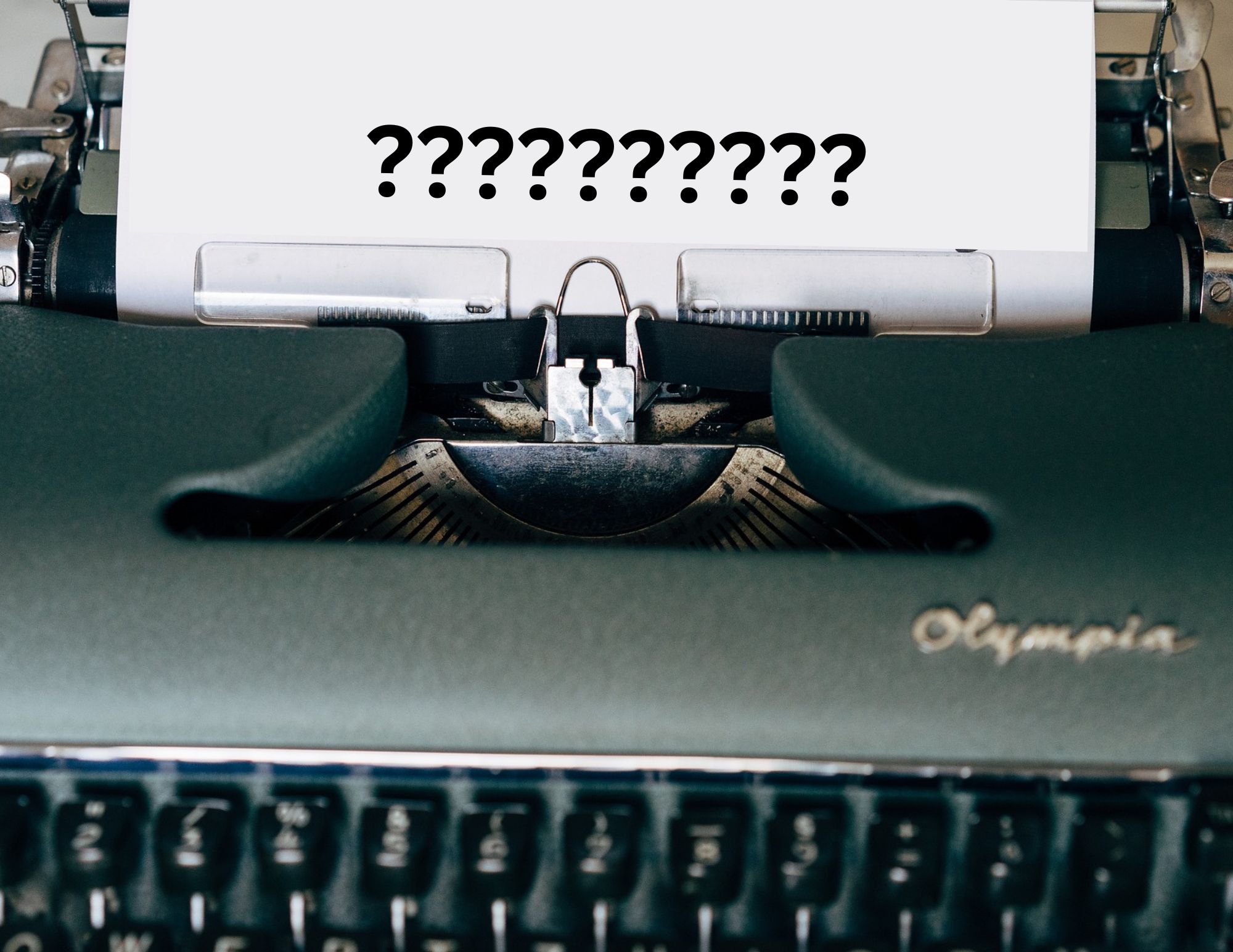 Typewriter with question marks