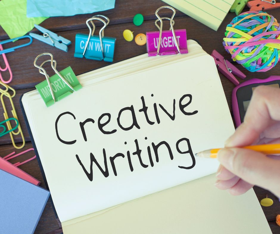 The words "Creative Writing" are in the center with a hand holding a pencil.  There are bright, colorful clips and post it notes scattered around the edges of the image.