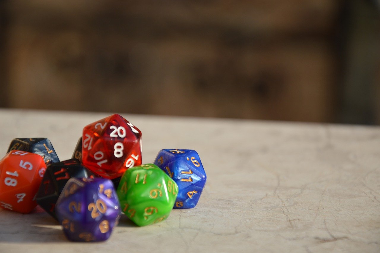 different tabletop dice in a stack