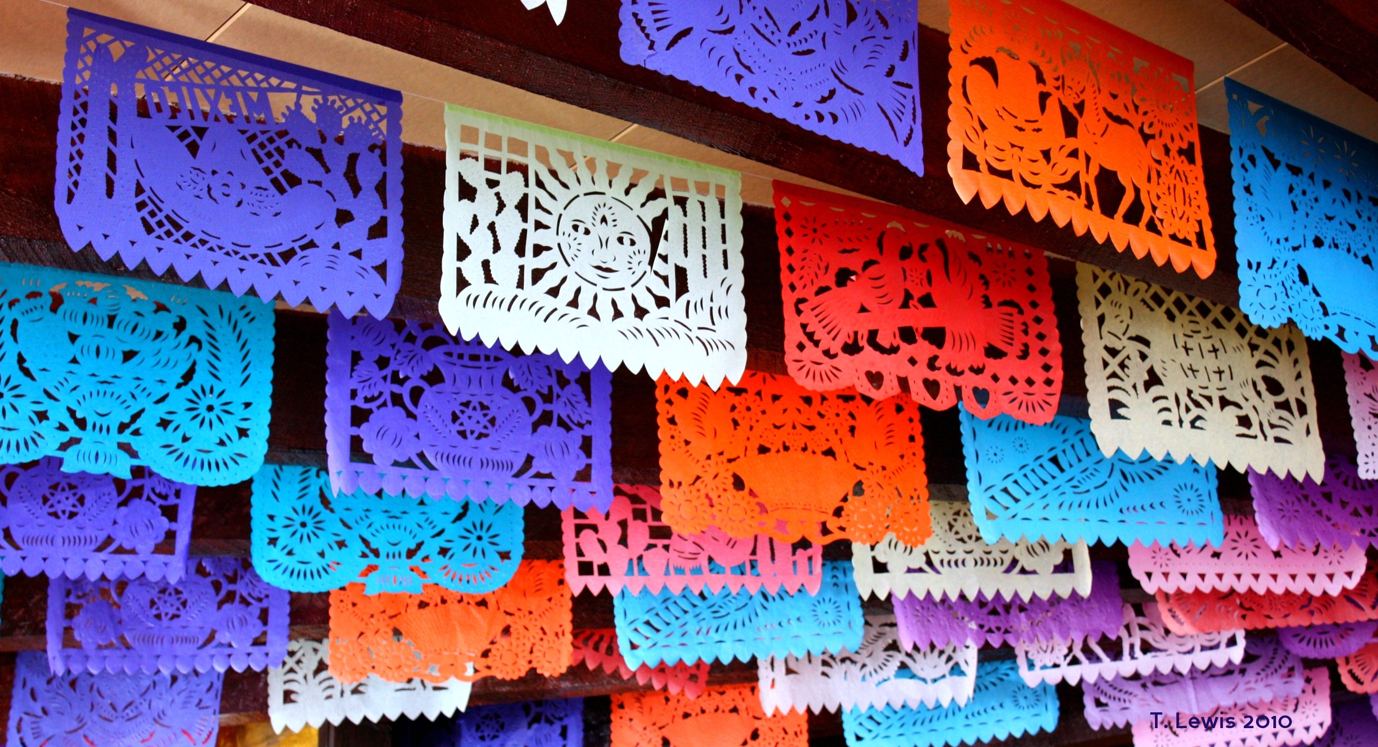 Colorful hanging papel picado banners - from Wikimedia Commons