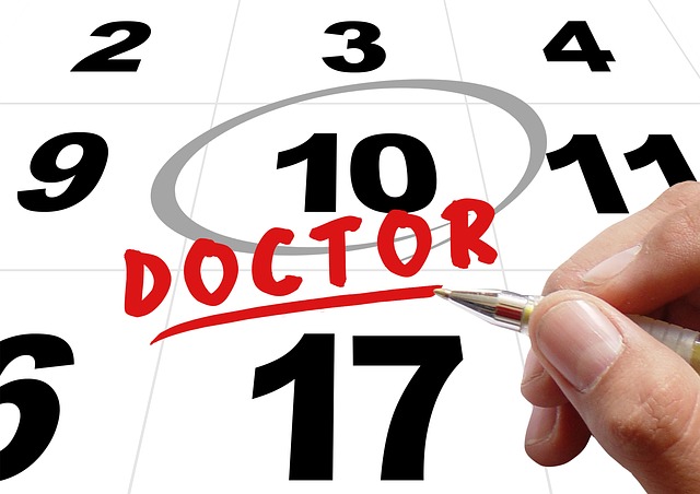 a calendar page with the 10th date circled and doctor written in red