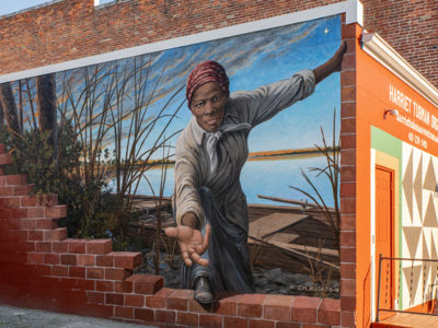 mural of Harriet Tubman reaching her hand out toward the viewer; located on the exterior wall of the Harriet Tubman Museum and Educational Center in Cambridge, MD