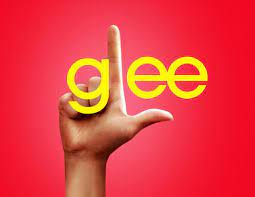 The Glee logo in yellow on a red background with a hand forming the "L".