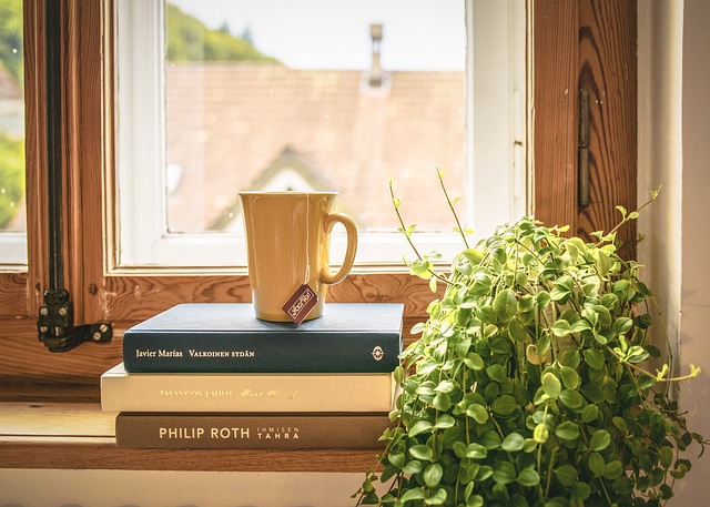 a cup ot tea on a pile of books