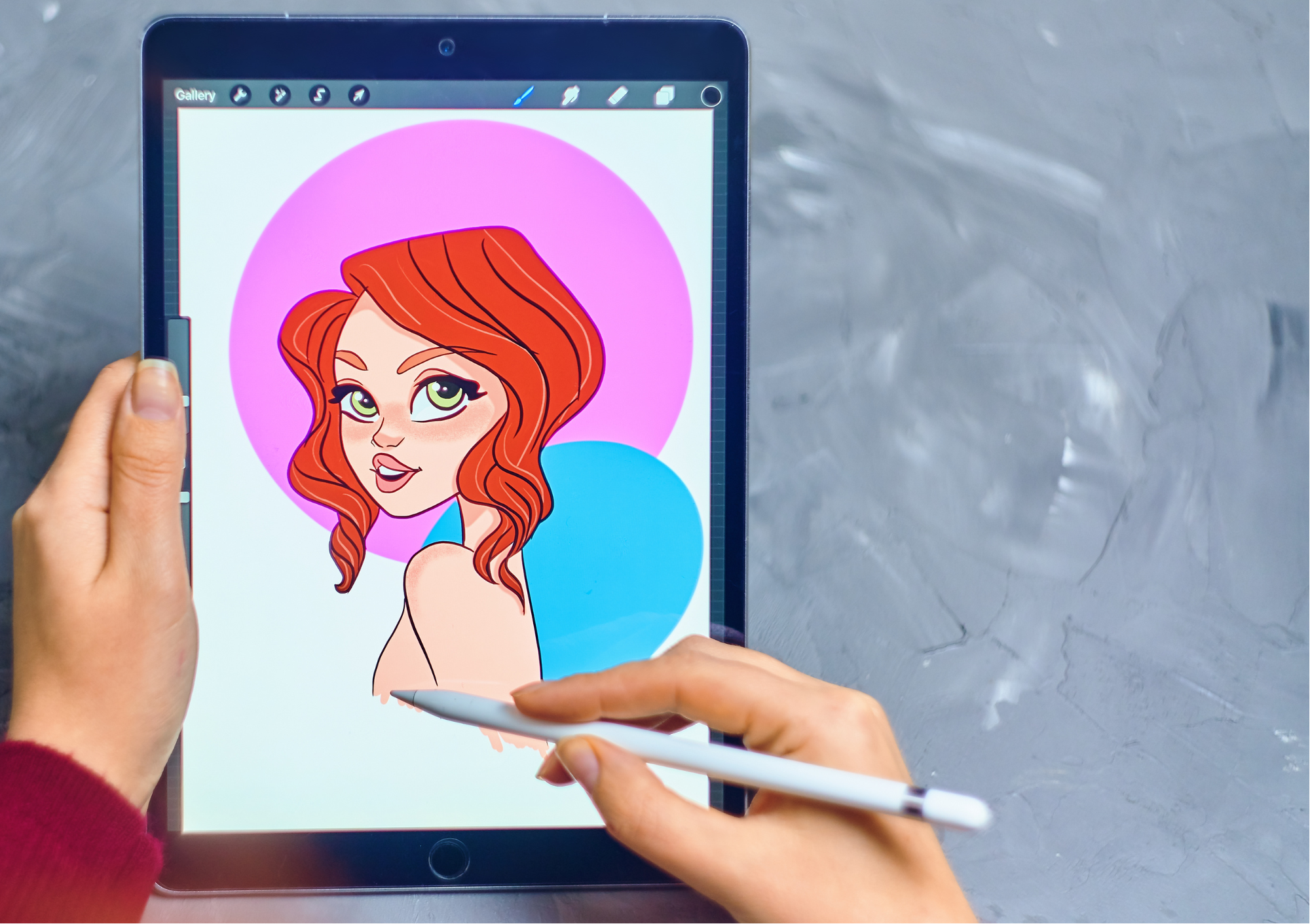 a hand holding an ipad pen while drawing a cartoon woman on an ipad  in the program Procreate