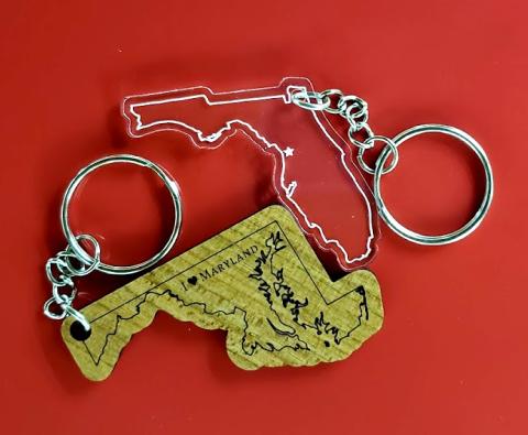 Wooden engraved keychain with Maryland outline. Text says "I Love Maryland" Florida acryclic cut and engraved keychain with star