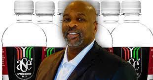 Asè Water bottles behind the founder Lee Putney, Sr. 