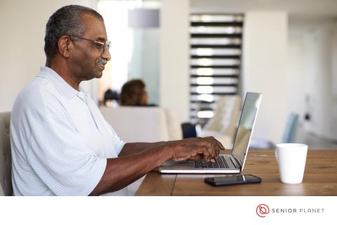 Senior man using laptop