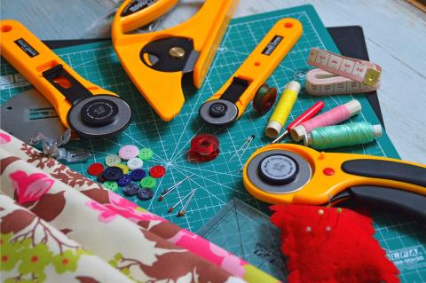 sewing tools laid out on a cutting mat