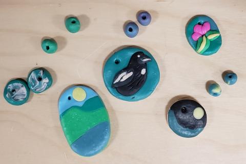 a selection of beads and charms made of polymer clay