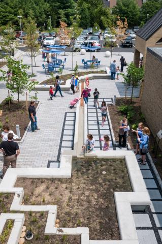 view of the savage branch's landscaping from above, large concrete planters full of soil and sprouting plants