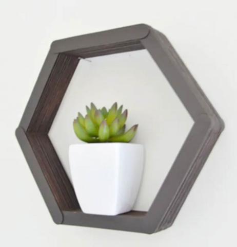 Grey hexagonal shelf hung on wall - Open Media