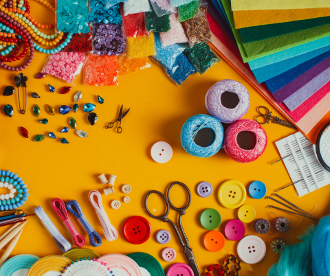 Variety of craft items arranged around the border of the photo