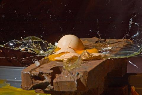 Egg shattering on brick - Nebarnix Flickr Creative Commons