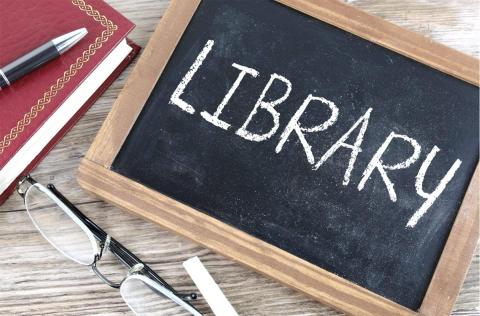 Chalk board with the word Library with a red book in corner - Creative Commons