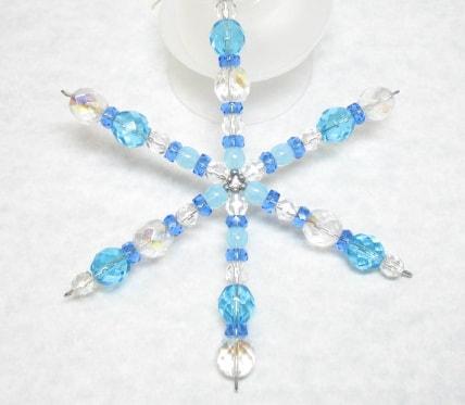 Blue and white beaded snowflake.