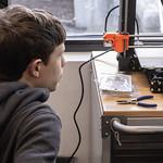 teen watching 3D printer