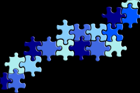 shades of blue puzzle pieces on a black background