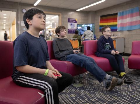 teens playing games on couches