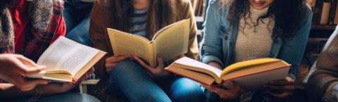 teens reading no faces shown