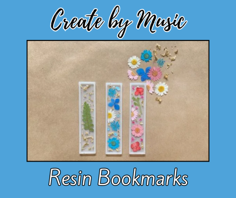 A blue background with black cursive text at the top reading “Create by Music.” Below, a rectangular photo shows three resin bookmarks placed side by side on a beige surface. Each bookmark contains dried flowers and gold flakes: the first has a green fern, the second features blue and white flowers, and the third displays pink and red flowers. Above the bookmarks, there is a scattered arrangement of colorful dried flowers in blue, pink, and white. At the bottom of the image, black text reads “Resin Bookmark