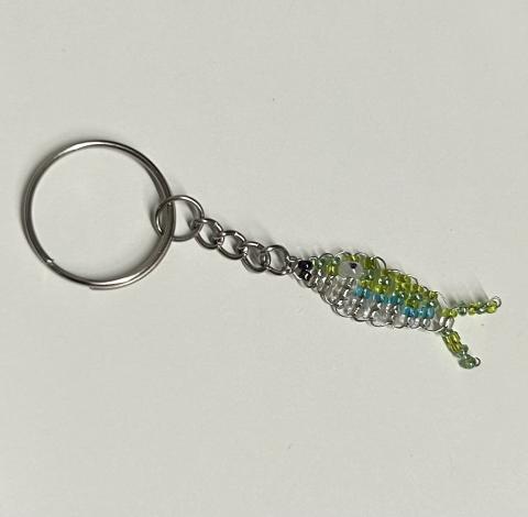 a keychain of a small beaded fish