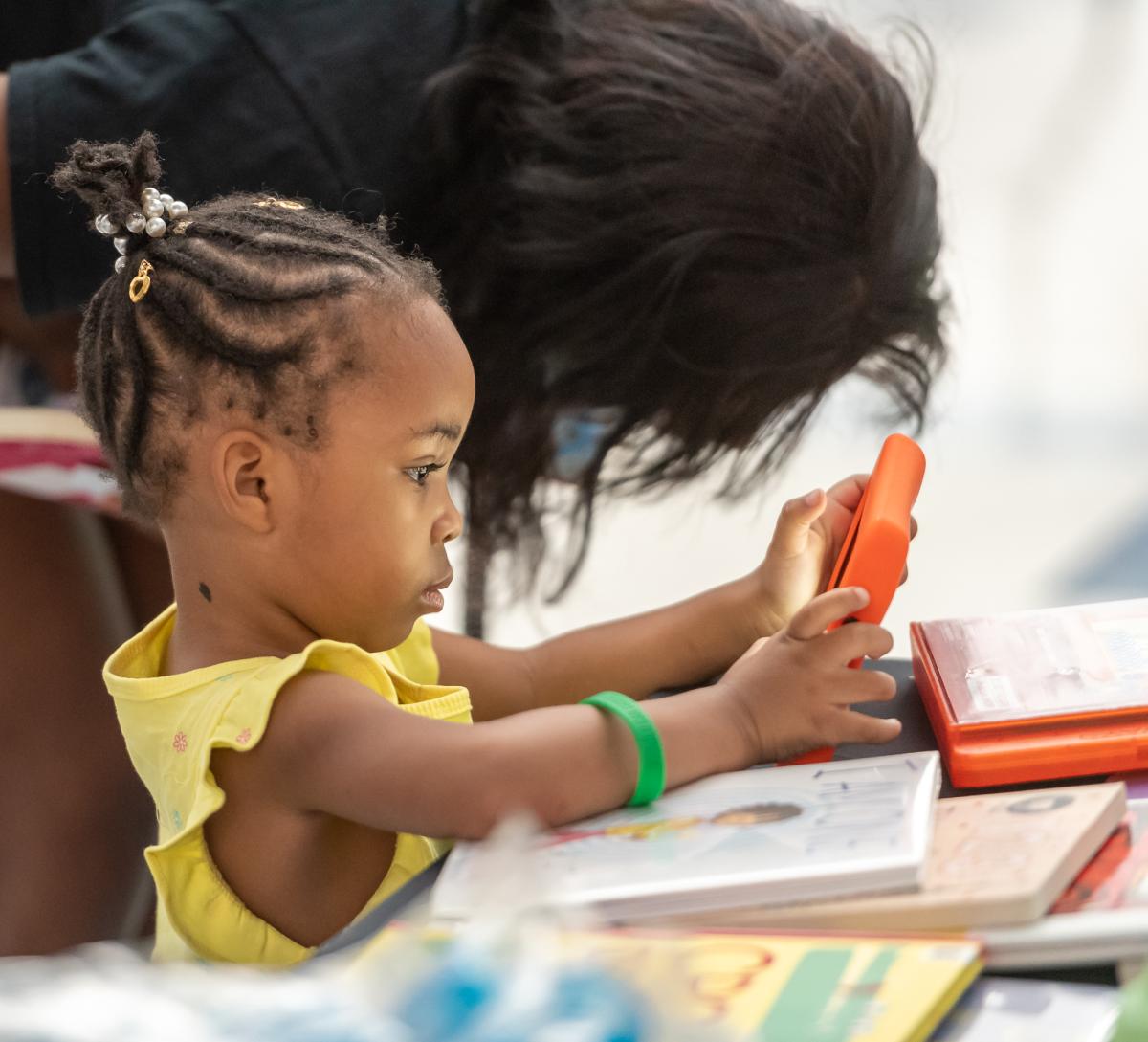 Child with ipad.