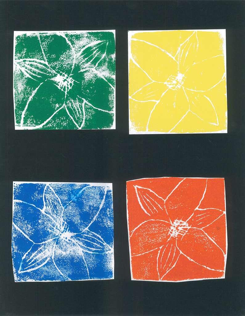 4 styrofoam block prints of the same flower, one each in green, yellow, blue, and red