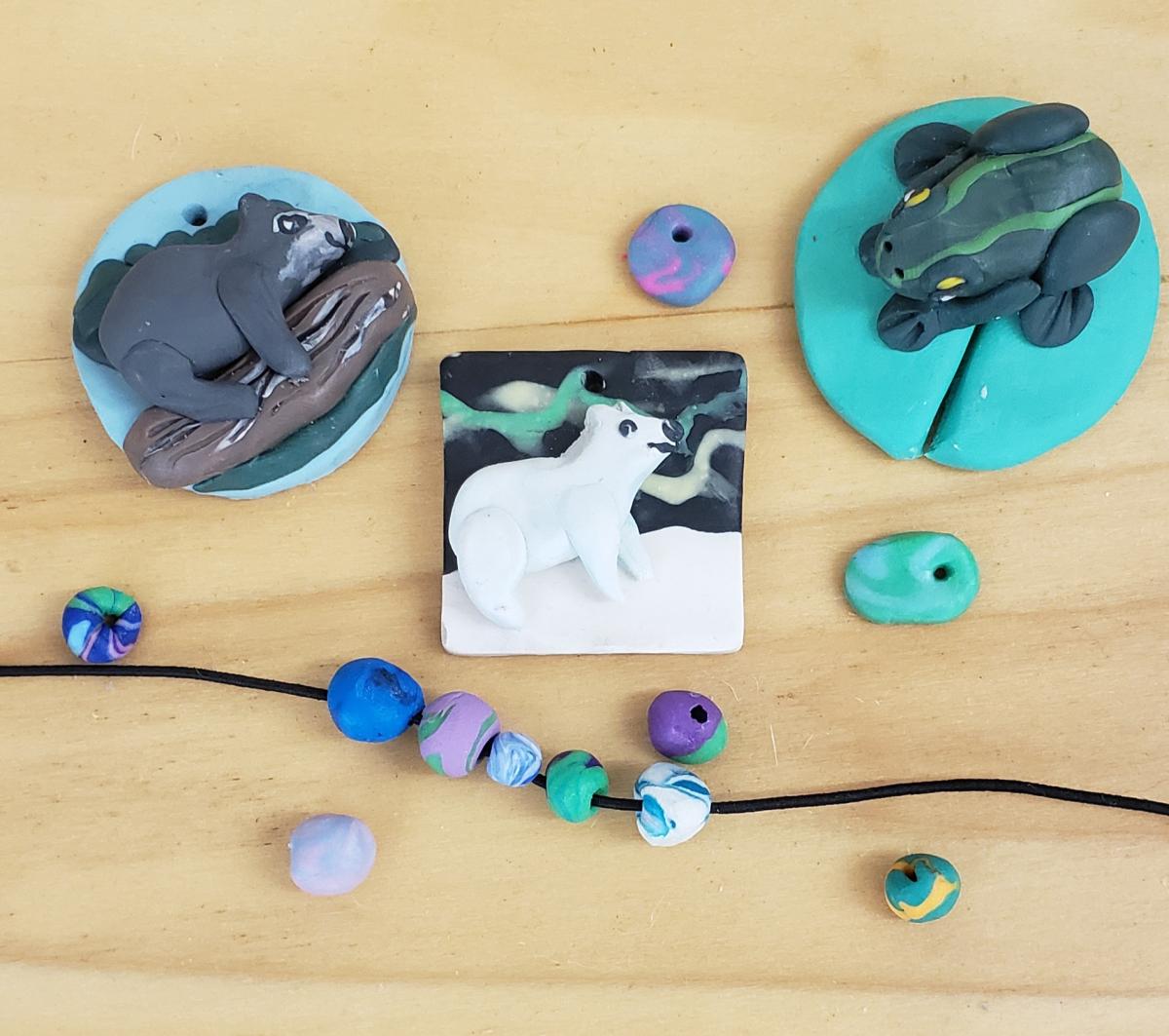 a selection of beads and charms made using polymer clay