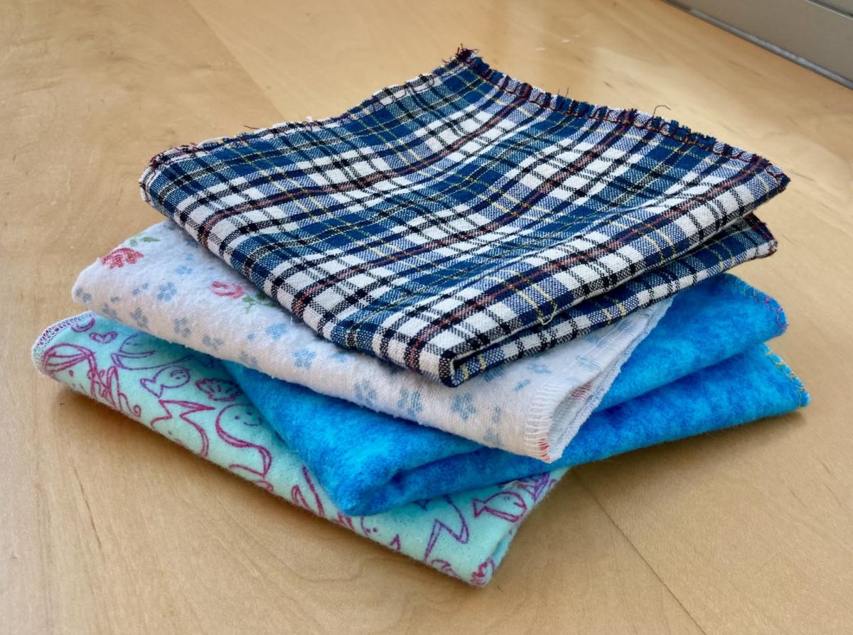 A stack of colorful folded washclothes