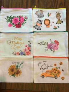 various makeup bags with decoupage art including flowers and animals