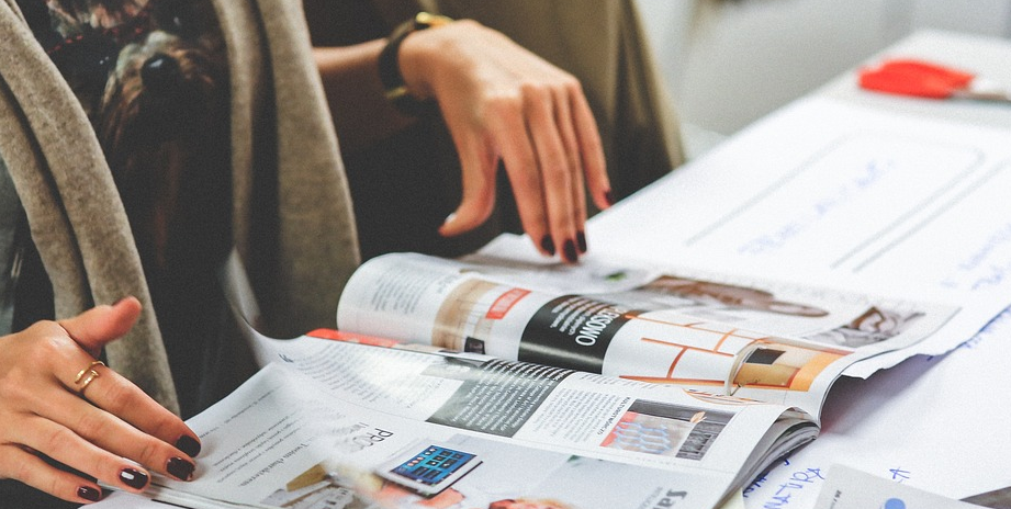 Girl flipping through a magazine.