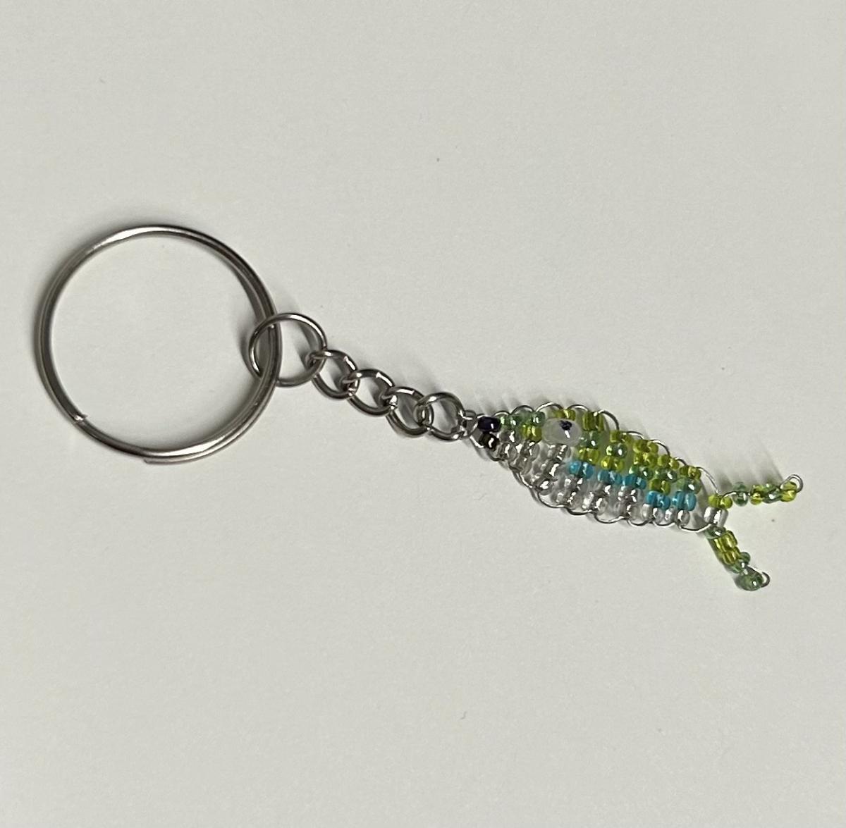 a keychain of a small beaded fish